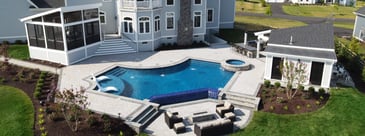Patio, pool, and screened-in porch in large backyard