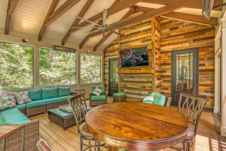 Porch interior with vaulted ceiling attached to home