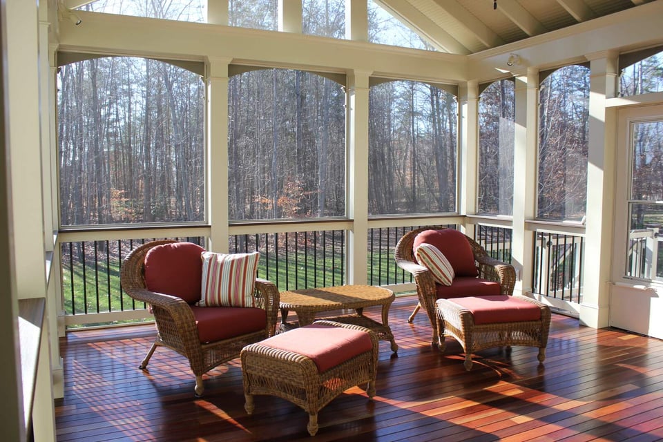 screened in porch with two chairs and leg rests and hardwood flooring in northern virginia