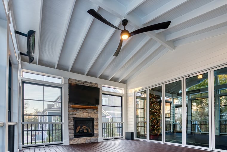 screened porch with floating tv fireplace fan and heater