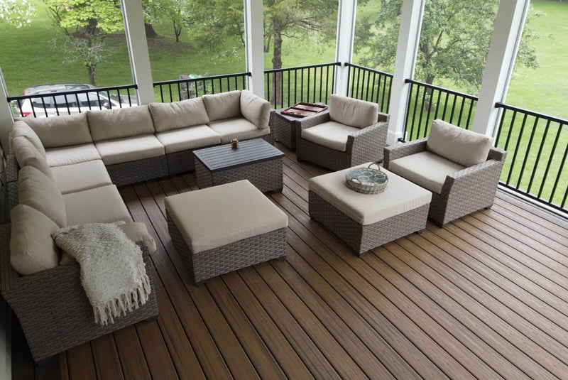 Screened-in porch with composite decking and furniture