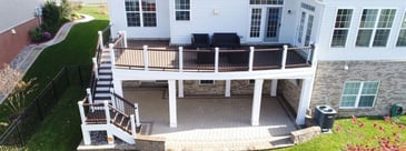 Second-story deck with stairs to patio and under deck space