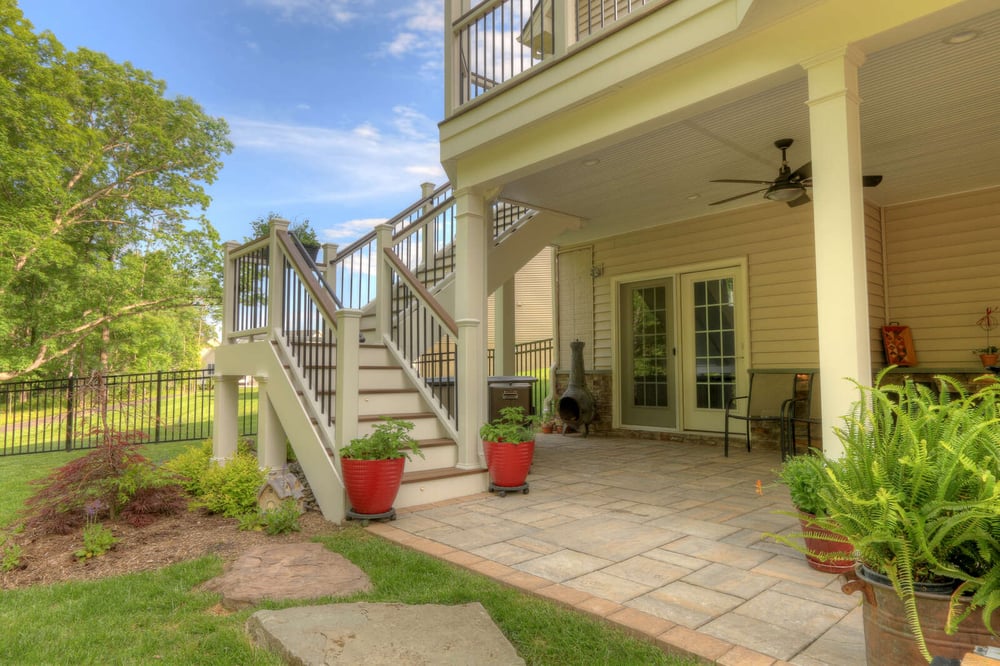 Stairs to under deck patio space with landscaping by Deckscapes of Virginia