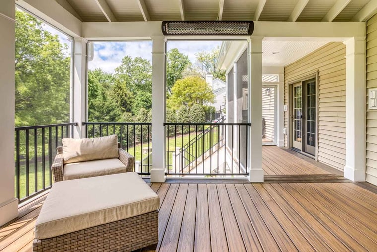 White columns and black railing on covered porch