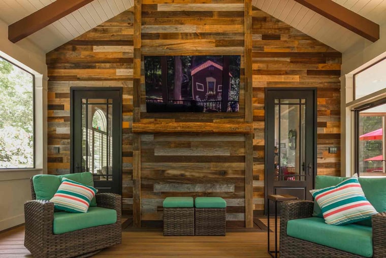 Wooden porch interior with vaulted ceilings and furniture