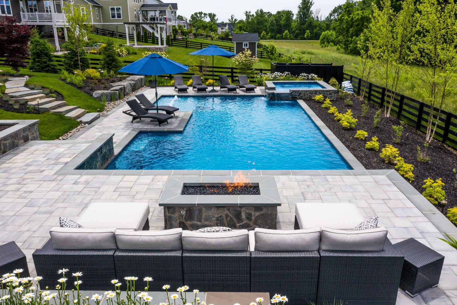 Beautiful stone aerial backyard with pool fire place in northern virginia