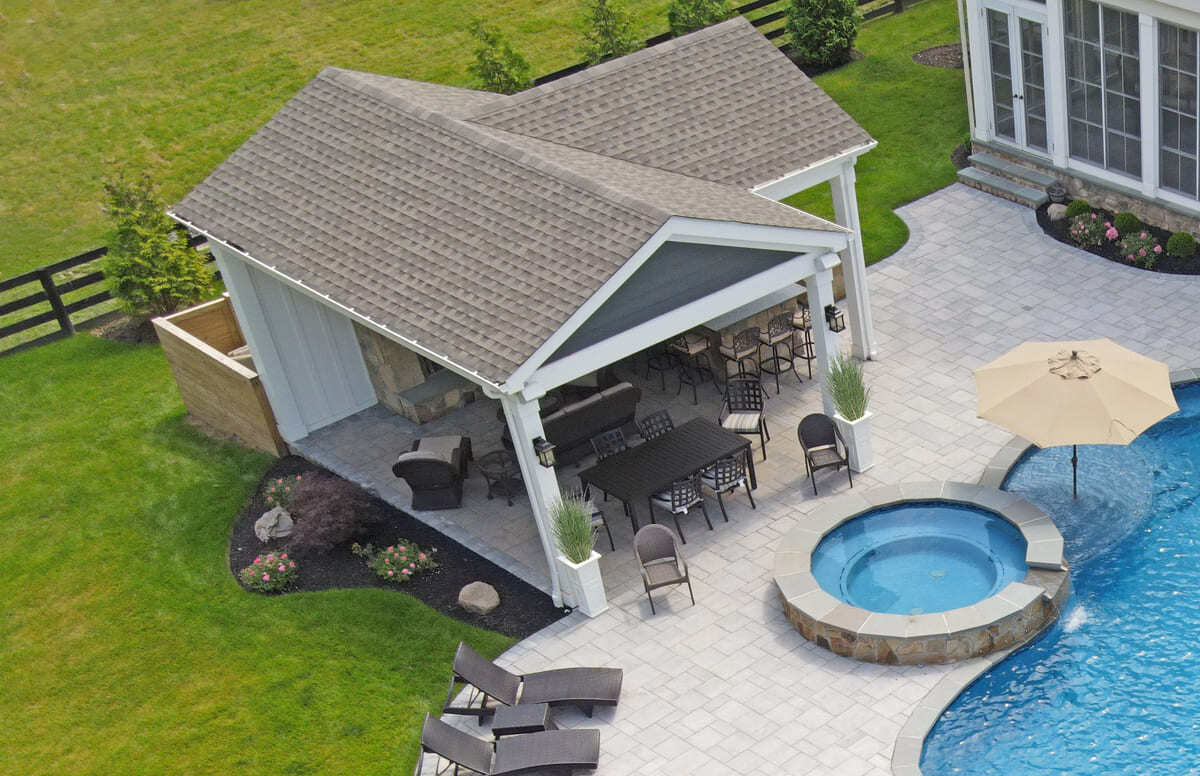Aerial view of outdoor living project with a pool and pool house by Deckscapes of VA in Northern Virginia