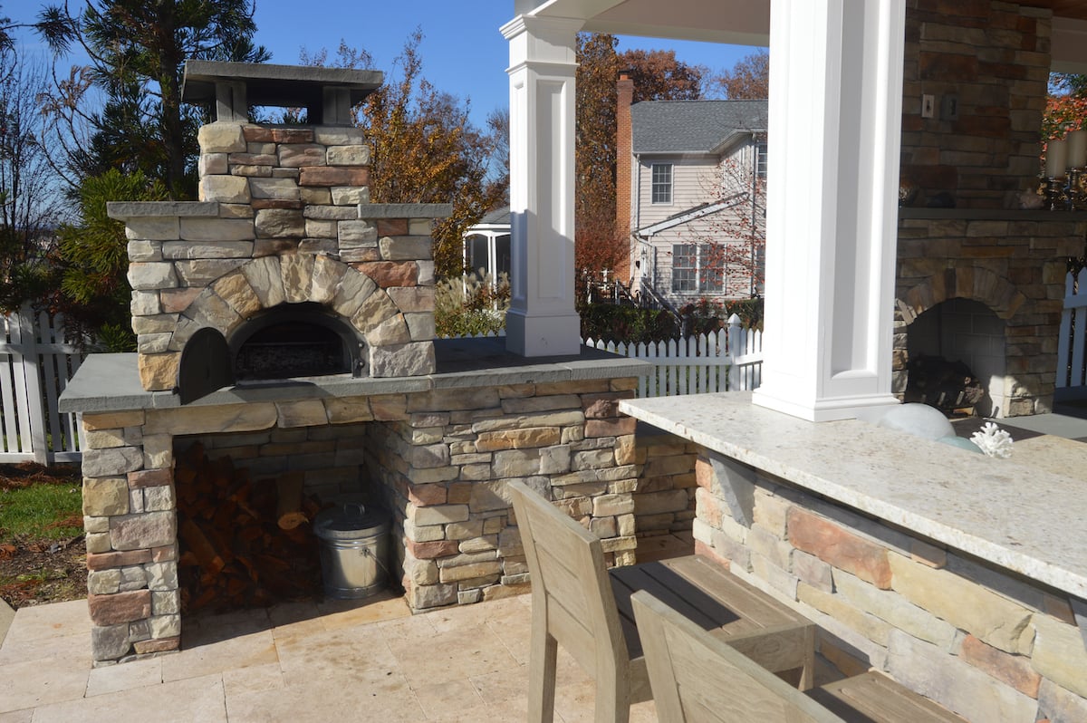 Outdoor stone fireplace with pizza oven