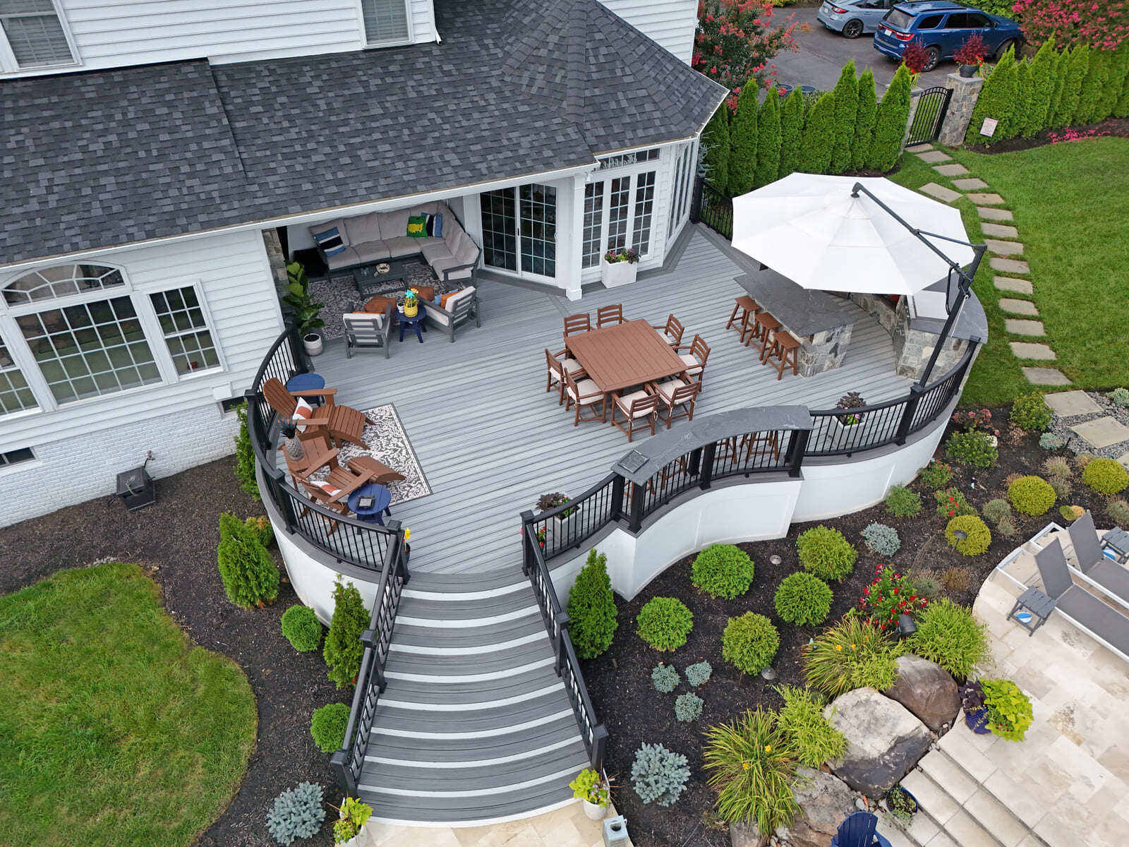 Drone view of curved deck and landscaping by Deckscapes of Virginia