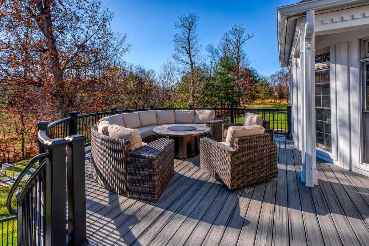 Wooden backyard deck in Norther Virginia with outdoor furniture