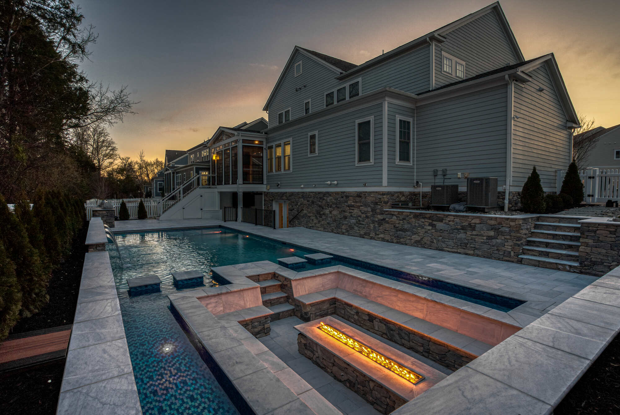 Luxury gunite pool in Northern VA by Deckscapes with in-ground seating and fire feature (1)