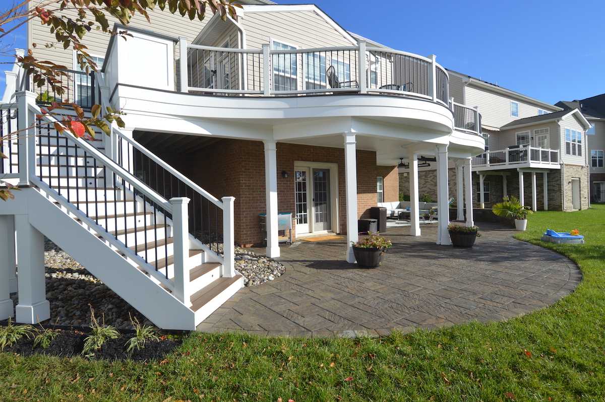 Under deck rain system with stairs and stone patio