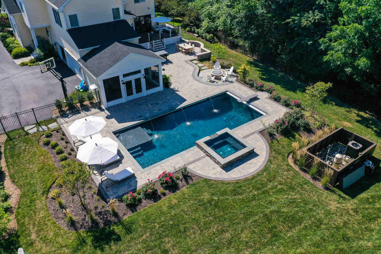 aerial backyard with inground pool waterfall hot tub and pavilion