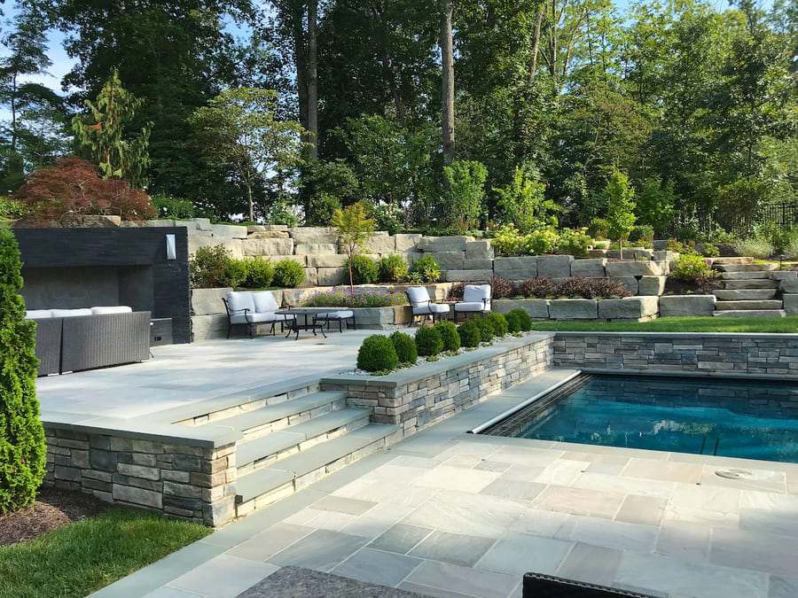 planting-and-patio-with-fireplace and pool in northern virginia